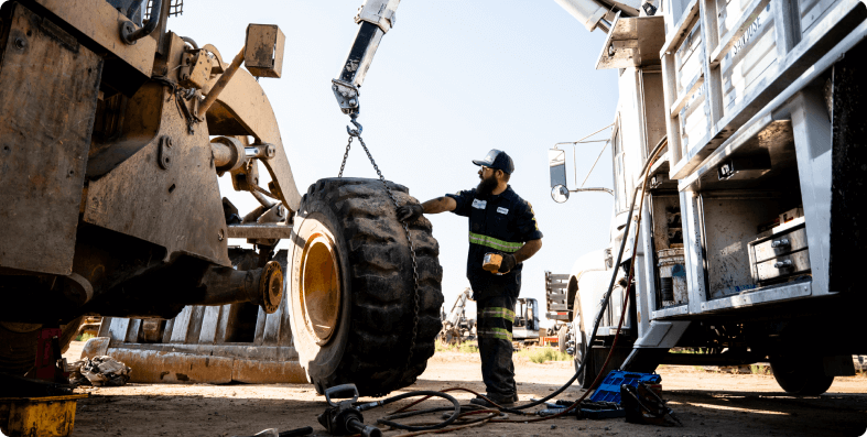 Mechanic checking a tire