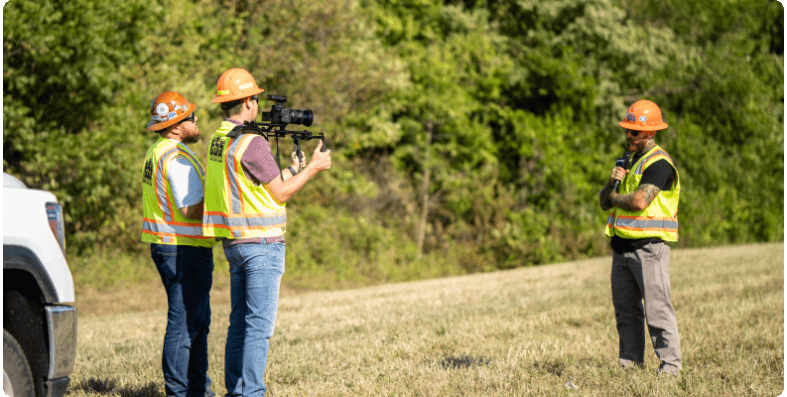 Dirt World crew making a video on a jobsite